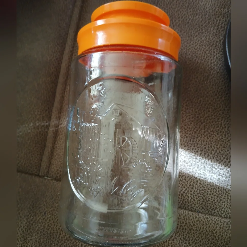 Vintage 1970s Glass Tang Jar with Orange Lid Wheel